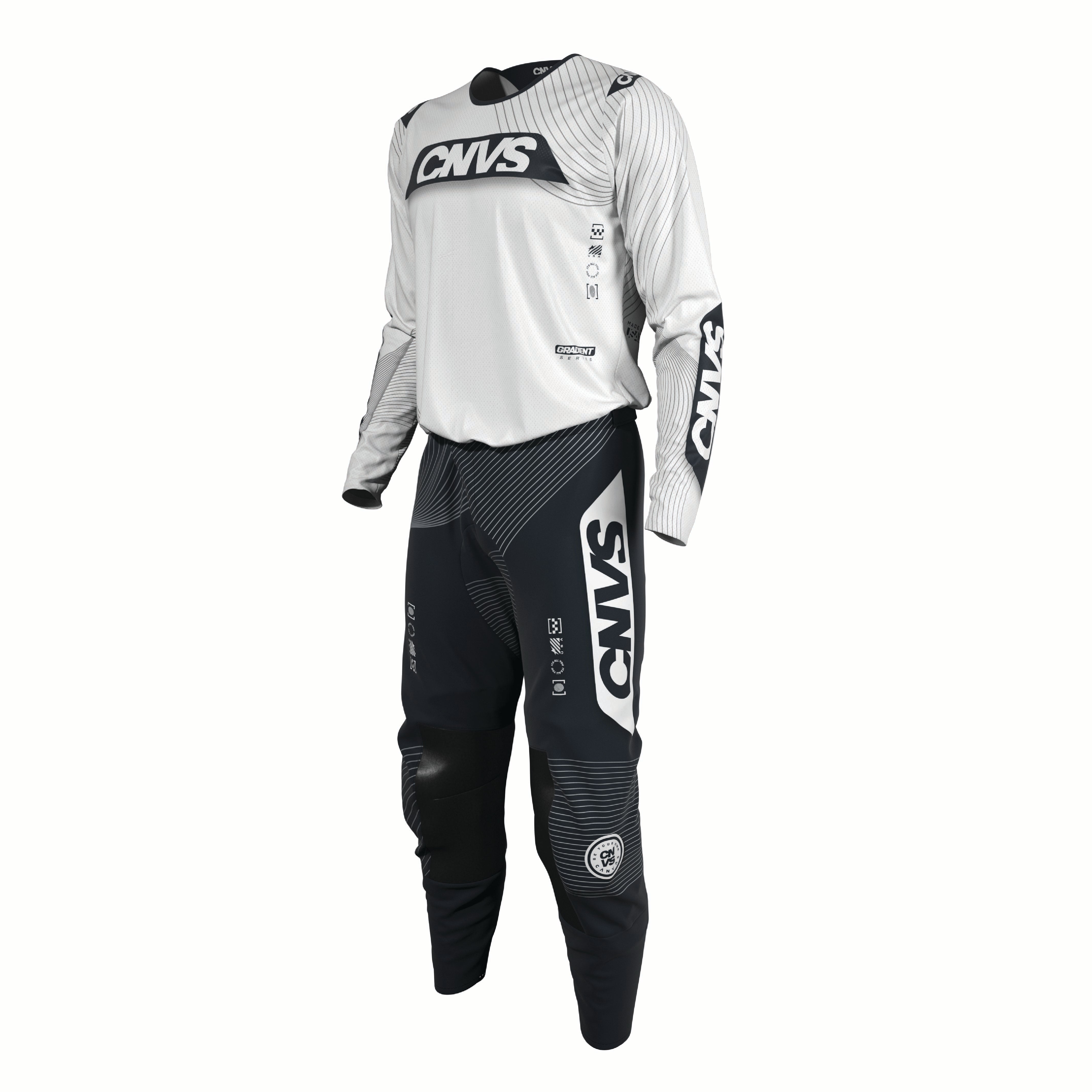 Motocross outfit with white top and black pants featuring 'CNVS' branding on a white background.